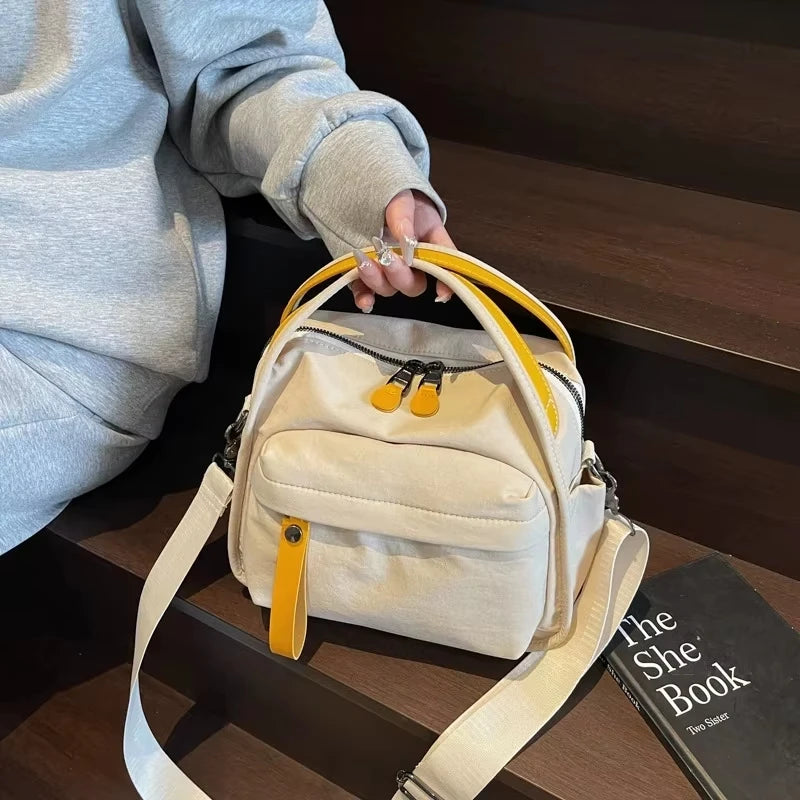 NORELLE – BOLSO BANDOLERA DE LONA OXFORD LIGERA